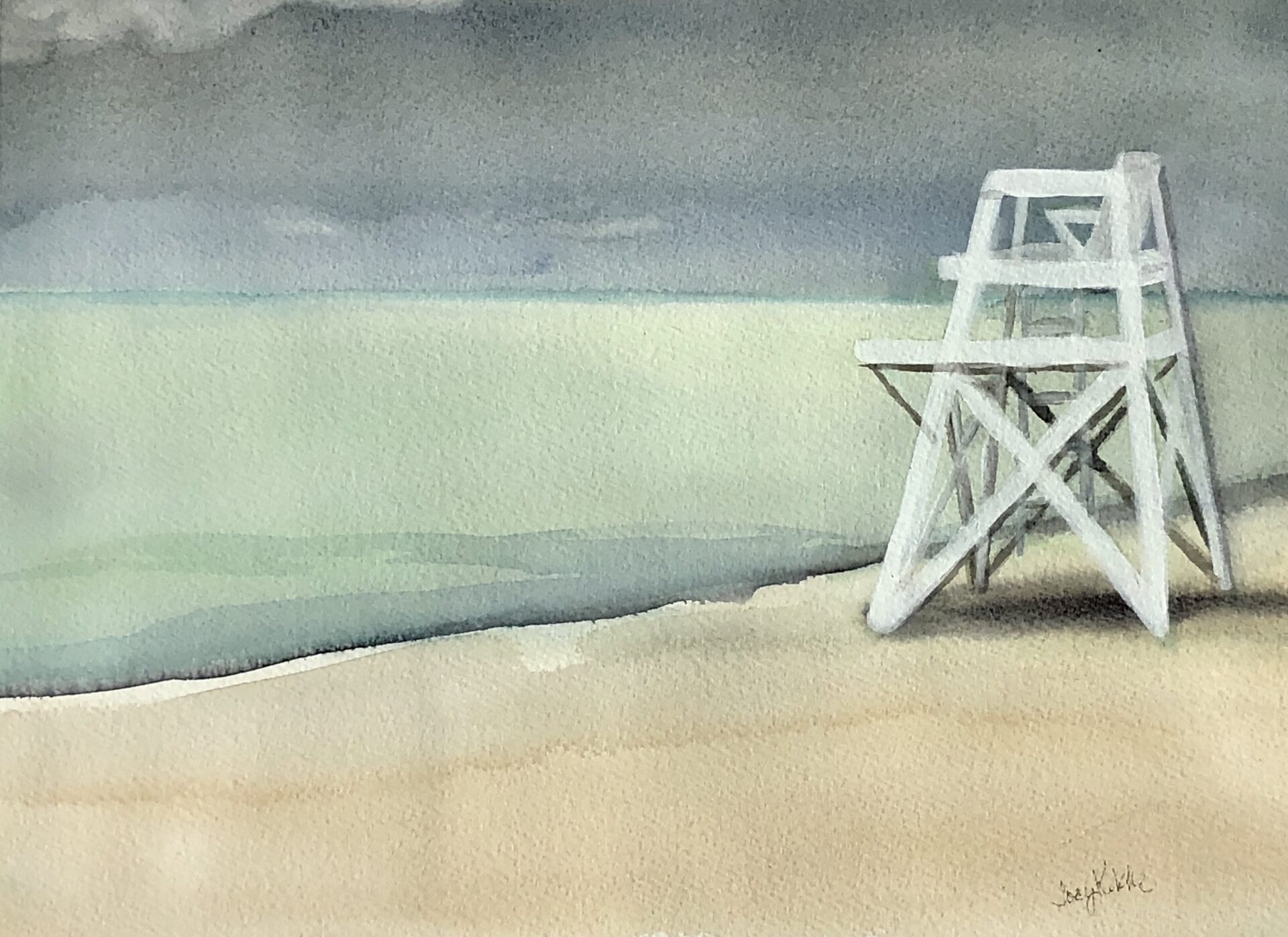 Lifeguard chair at the late winter beach. The water is pale green.