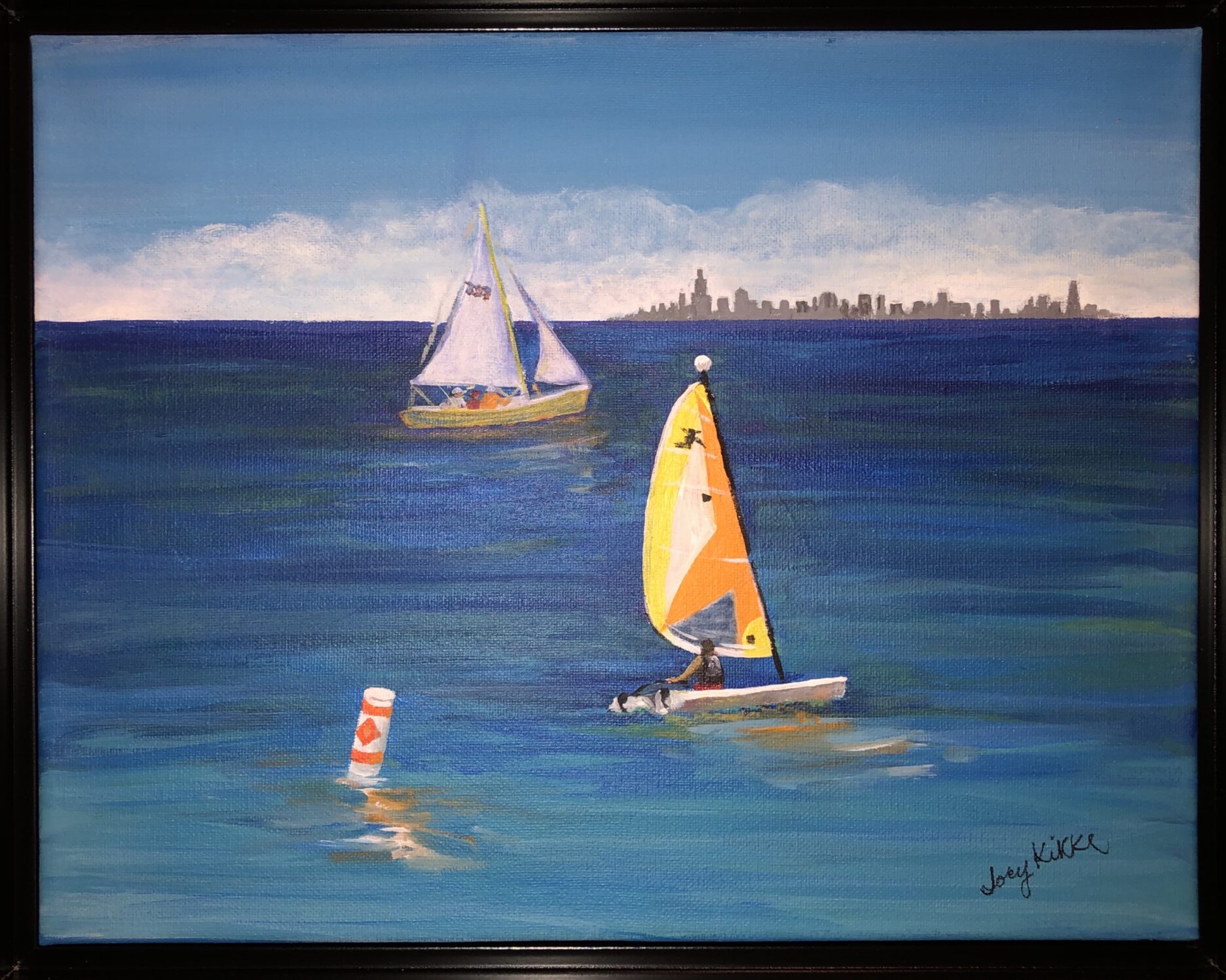 A beautiful summerday at the shore. City skyline in the distance, a small and bigger sailboat in the fore and middle ground.