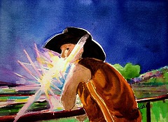 Young cowboy with the spotlight in his eye, watches the rodeo