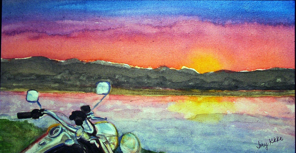 Sunrise over a river with a Harley in the foreground