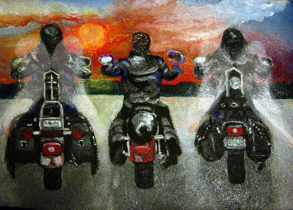 Barely seen wings of angel bikers flank a human biker