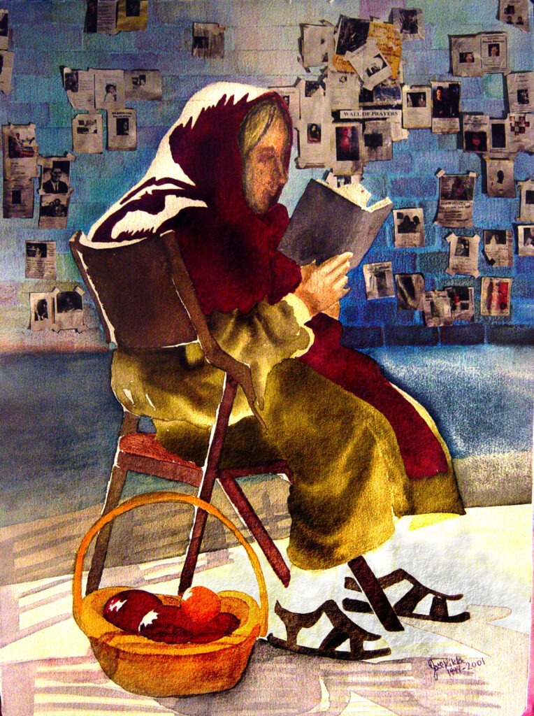 After 9/11 an elderly woman reads her Bible in front of the Wall of Prayer